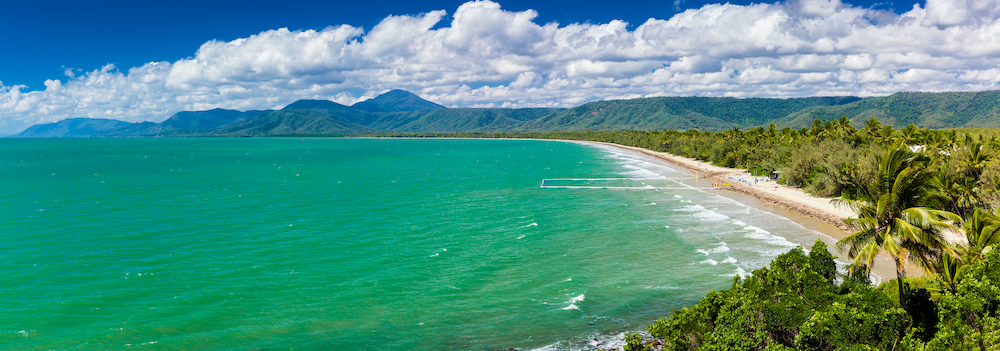 Port Douglas four mile beach and ocean on sunny day, Queensland, Australia